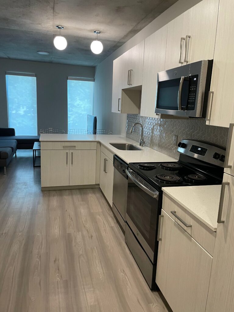 Kitchen with stainless steel appliances and wood floor
