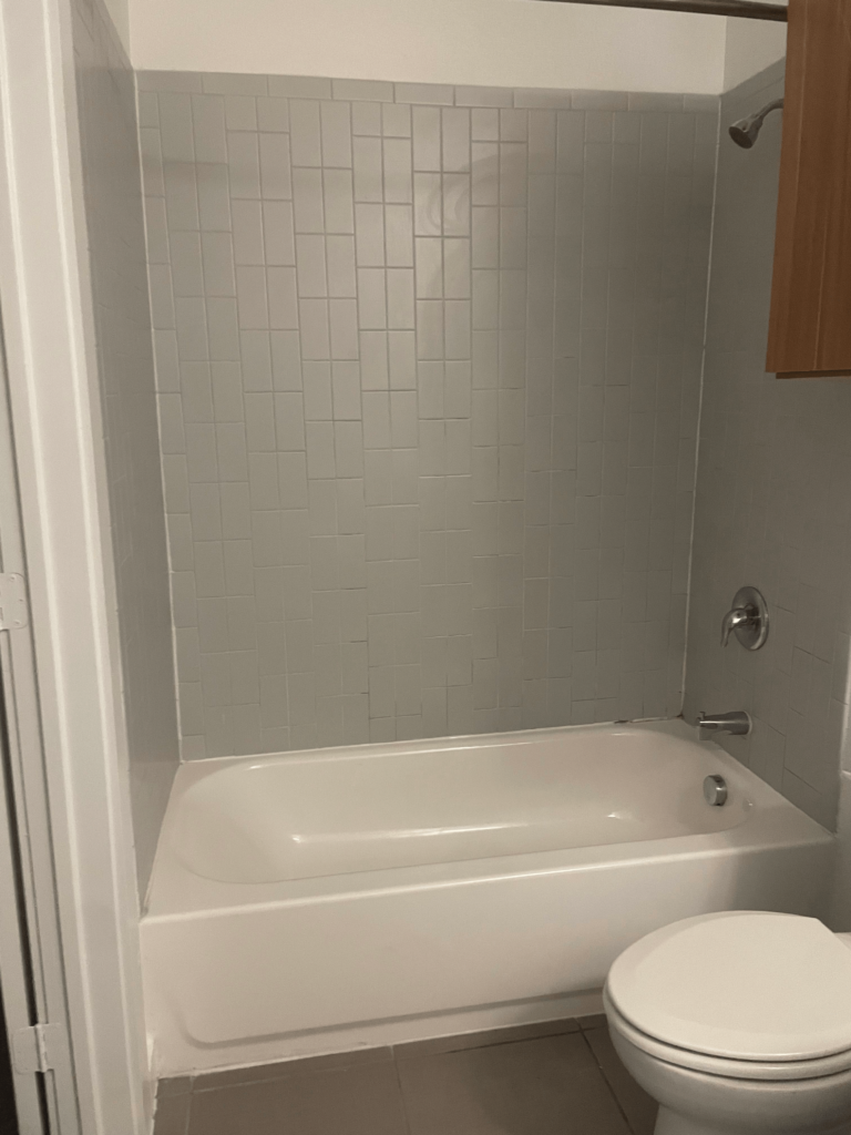 A cleaned tub shower in a bathroom