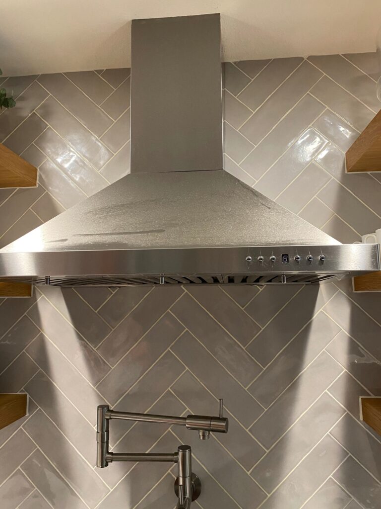 Residential kitchen hood cleaned with eco-friendly products